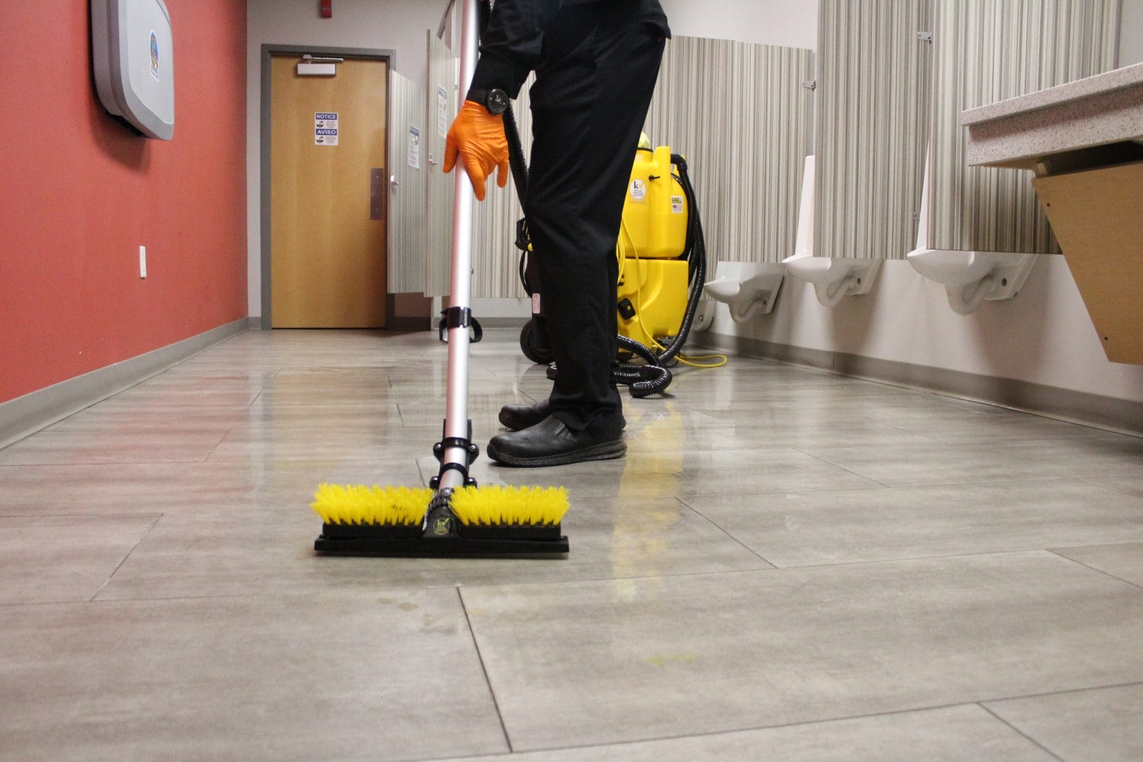 Phelps Smart Clean specialist cleaning a commercial restroom.