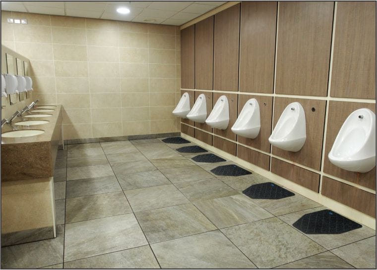 Bathroom urinals with specialty mats for cleanliness, and odor control