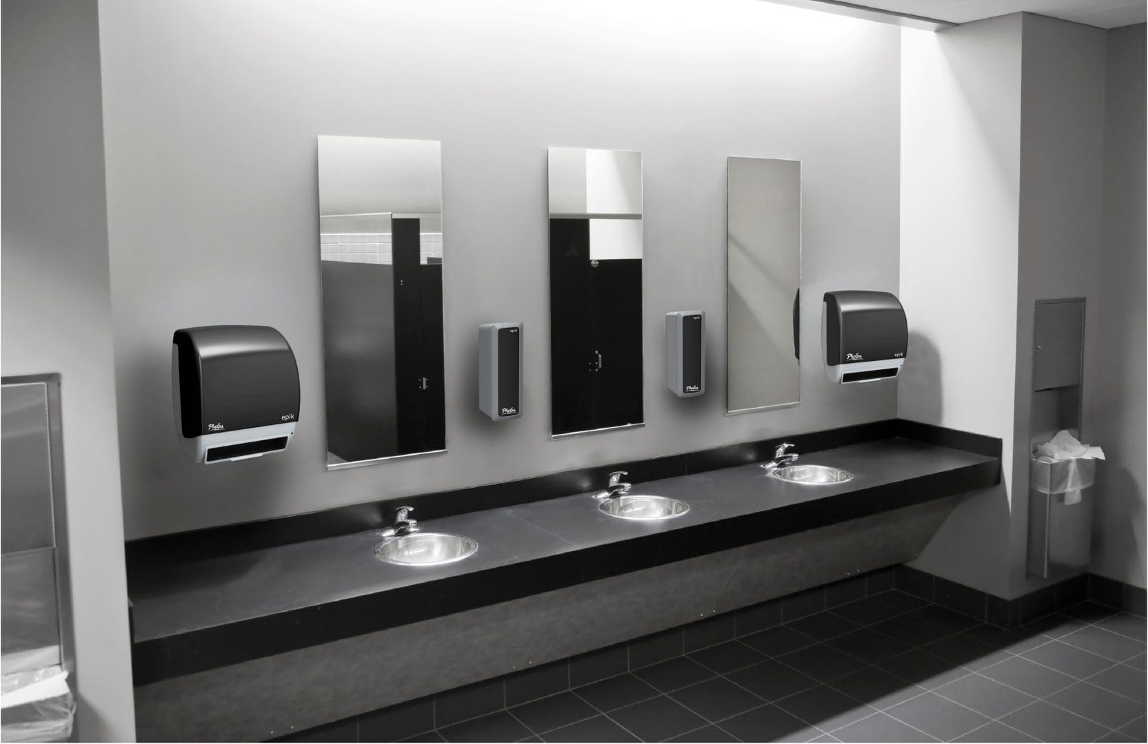 Clean facility restroom with Phelps towel and soap dispensers.