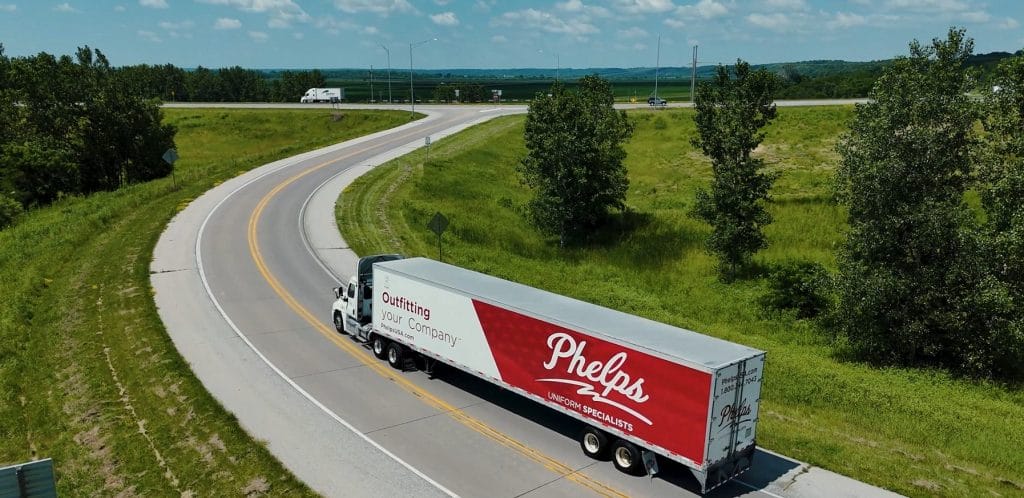 Phelps delivery truck driving on the highway, representing reliable service